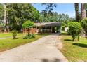 A single-story brick house with mature trees and green lawn at 1709 Whitfield Ave, Rocky Mount, NC 27801