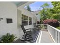 Inviting front porch with rocking chairs, perfect for relaxing and enjoying the outdoors at 1812 Hilton St, Raleigh, NC 27608