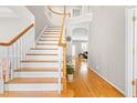 Spacious home foyer showcasing hardwood floors, staircase, and open layout at 203 Worsham Dr., Chapel Hill, NC 27516