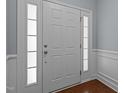 Elegant white front door with sidelights, creating a welcoming entrance to the home at 2082 Weston Green Loop Loop, Cary, NC 27513