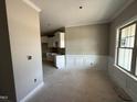 Bright dining room featuring elegant trim work and a large window, awaiting personalization at 2760 Rains Mill Rd, Princeton, NC 27569