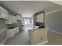 Kitchen with classic white cabinets and an open layout, ready for culinary creations at 2760 Rains Mill Rd, Princeton, NC 27569