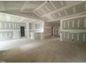 Unfinished living room featuring high ceilings, and an open-concept floor plan at 2760 Rains Mill Rd, Princeton, NC 27569