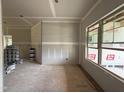 Unfinished living room shows drywall and window, ready for customization and design at 2760 Rains Mill Rd, Princeton, NC 27569