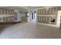 Spacious living area with an open layout ready for flooring and finishing touches at 2776 Rains Mill Rd, Princeton, NC 27569