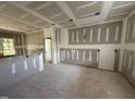 Open living room with space for gathering, and large window for natural light at 2776 Rains Mill Rd, Princeton, NC 27569