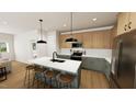 Modern kitchen boasts a large island with seating, stainless steel appliances, two toned cabinets, and stylish pendant lighting at 338 Beacon Dr, Pittsboro, NC 27312
