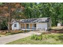 This single story home boasts a lovely yard, a covered front porch, and a fresh exterior paint job at 3916 W Allen, Raleigh, NC 27603
