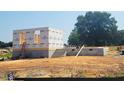 New construction home shows the start of a beautiful Davidson home with a concrete foundation and framing at 422 Grading Stick Ct, Angier, NC 27501