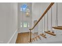 Elegant foyer featuring a staircase, chandelier, and front door with leaded glass at 5121 Ten Point Trl, Wake Forest, NC 27587