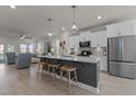 Bright kitchen with an island and bar stool seating, and stainless steel appliances at 518 Toran Dr, Wake Forest, NC 27587