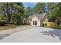 This single-Gathering home boasts a spacious driveway with ample parking and a well-kept exterior at 5301 Northpines Dr, Raleigh, NC 27610