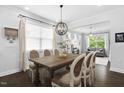 Elegant dining room featuring stylish furnishings and a contemporary chandelier, perfect for gatherings at 1002 Gilly Ct, Durham, NC 27703
