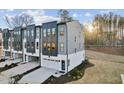 Beautiful exterior of this two-story townhome with a modern color scheme, garage, and landscaped yard at 10518 Pleasant Branch Dr # 38, Raleigh, NC 27614