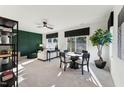 Bright living room featuring a ceiling fan, modern furniture, and a large window with natural light at 10518 Pleasant Branch Dr # 38, Raleigh, NC 27614
