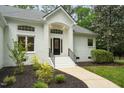 Close up of front entrance highlighting architectural details and landscaped yard at 12301 Hardee Rd, Raleigh, NC 27614