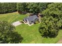 Spacious property featuring a well-manicured lawn and wooded surroundings at 133 Creekstone Dr, Benson, NC 27504