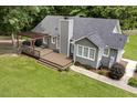 A cozy backyard features a large deck with a pergola, great for outdoor entertaining at 133 Creekstone Dr, Benson, NC 27504