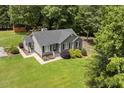Charming one-story home with well-maintained lawn and mature landscaping at 133 Creekstone Dr, Benson, NC 27504