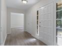 Inviting foyer with wood-look floors and views into adjacent rooms, creating an open feel at 136 Sycamore St, Cary, NC 27513