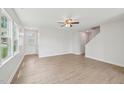 Inviting living area featuring light wood flooring, a white front door, and an abundance of natural light at 1534 Glenwater Dr, Cary, NC 27519