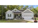 Charming home with a well-manicured lawn and a welcoming entrance, complete with a two-car garage at 176 Lowery Ln, Benson, NC 27504