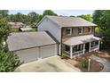 Aerial view of a two-story brick home with a large two-car attached garage at 2127 Somers Ave, Burlington, NC 27215