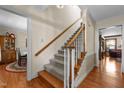 Classic staircase with wood and carpet, leading to the upper level of the home at 2127 Somers Ave, Burlington, NC 27215