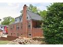 A home featuring detailed brickwork, mature trees, and a private backyard at 2210 Hope St, Raleigh, NC 27607