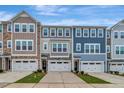 Attractive townhouse exteriors with neat landscaping, driveways, and multi-toned facades at 2299 Bay Minette Sta # 537, Apex, NC 27502