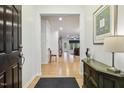 Bright foyer with hardwood floors, leading into an open-concept living area at 2410 Kinglass Dr, Fuquay Varina, NC 27526
