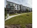 Modern townhome community with well-manicured lawns and sidewalks, creating a welcoming atmosphere at 2908 Kempthorne Rd # 53, Cary, NC 27519
