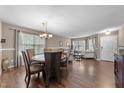 Cozy dining area with hardwood floors, open floor plan, and a round dining table for Gathering gatherings at 3359 Marshlane Way Way, Raleigh, NC 27610