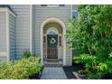 Inviting front door with a wreath and decorative 