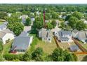 Aerial view of the home showing its placement in a neighborhood with mature trees and ample backyard space at 5312 Suntan Lake Dr, Raleigh, NC 27610