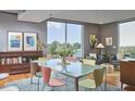 Dining room with large window, table with six chairs, and modern decor at 601 W Rosemary St # 416, Chapel Hill, NC 27516