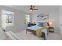 Bright bedroom with a comfortable bed, modern decor, and ample natural light creating a relaxing space at 6415 Mentor Pl, Raleigh, NC 27616