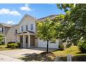 Charming two-story home with a two-car garage and well-maintained landscaping at 833 Ember Dr, Durham, NC 27703