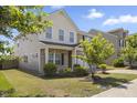 Charming two-story home featuring a brick facade and well-maintained landscaping at 833 Ember Dr, Durham, NC 27703
