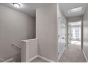 Second floor hallway with plush carpeting and access to multiple bedrooms at 874 John St, Clayton, NC 27520