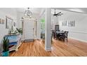 Inviting foyer with hardwood floors, high ceilings and views of the dining room at 107 Regiment Way, Durham, NC 27705