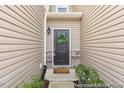 Charming entryway with a decorative wreath and manicured landscaping at 133 Explorer Dr # 258, Morrisville, NC 27560