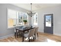 Dining area with table set for entertaining and filled with natural light at 1514 W Knox St, Durham, NC 27705