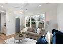 Inviting living room with hardwood floors, neutral tones, and abundant natural light at 1514 W Knox St, Durham, NC 27705