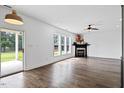 Spacious living room with fireplace and sliding glass doors to the patio at 206 Wynngate Dr, Cameron, NC 28326