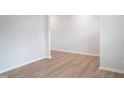 Spacious living room features light gray walls and light wood flooring at 2106 Cherry Creek Road Rd, Haw River, NC 27258