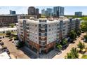 A contemporary apartment building with private balconies boasts a stylish exterior design in an urban setting at 222 Glenwood Ave # 714, Raleigh, NC 27603