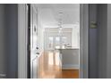A bright, open kitchen leads into a living space with beautiful flooring and recessed lighting at 222 Glenwood Ave # 714, Raleigh, NC 27603