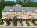 Aerial view showcases the townhome community's well-maintained roofs, landscaping, and overall neighborhood layout at 2609 Stewart Pines Dr, Raleigh, NC 27615