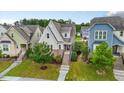 Charming home featuring neutral siding, brick accents, and a welcoming front porch and manicured landscaping at 2837 Milano Ave, Apex, NC 27502